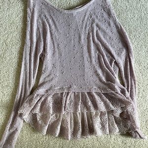 Cute purple sweater with ruffle detail on bottom